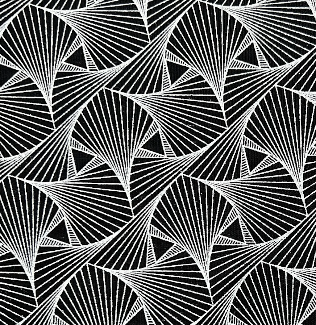 Black and white geometric art deco pattern featuring repeating fan-like radial motifs and triangular shapes.