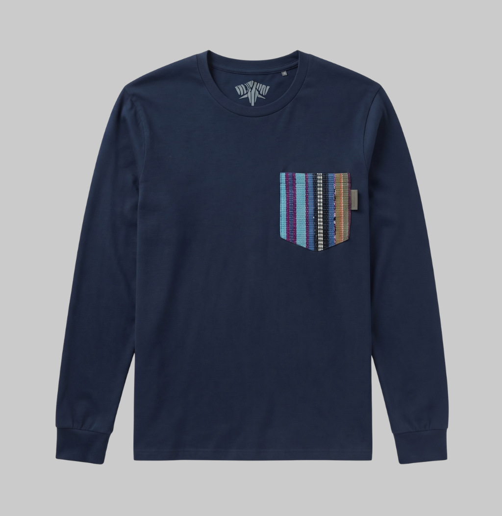 A navy blue long-sleeve crewneck shirt with a chest pocket featuring vertical stripes in purple, blue, brown, and white, shown against a solid gray background.