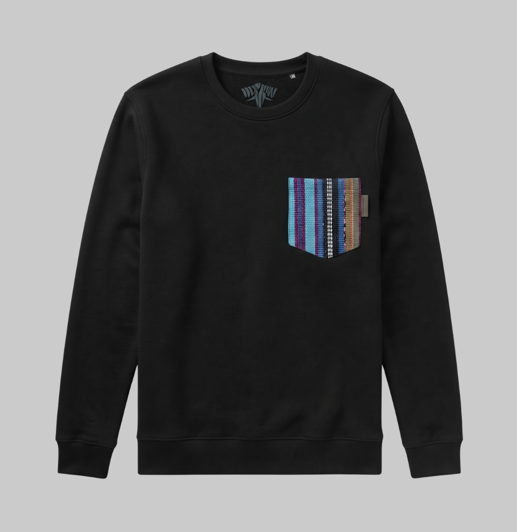 A black crewneck sweatshirt with a multi-colored striped knit chest pocket, shown flat against a solid gray background.