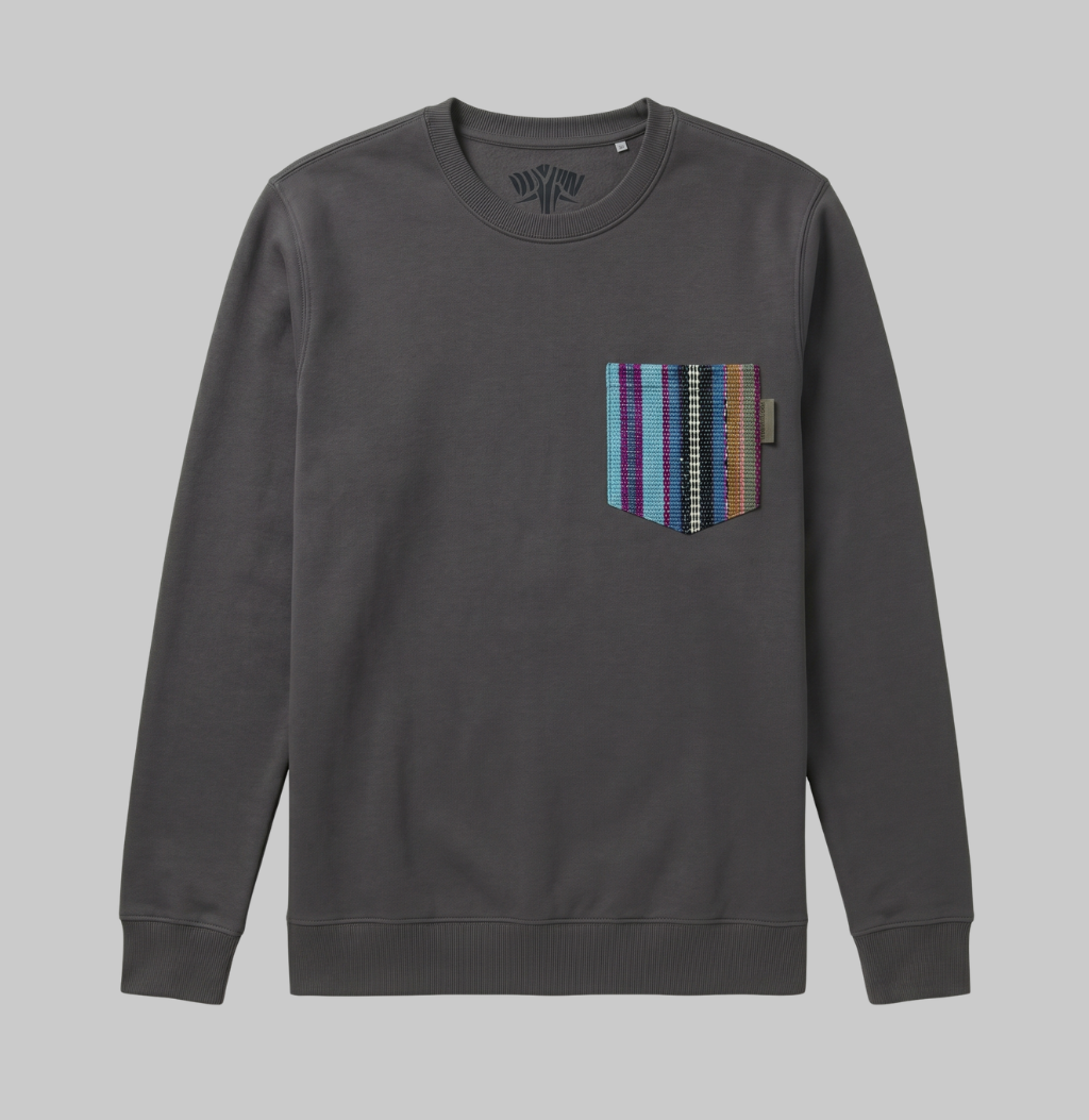A dark gray crewneck sweatshirt with a multi-colored striped knit pocket on the left chest, shown against a solid gray background.