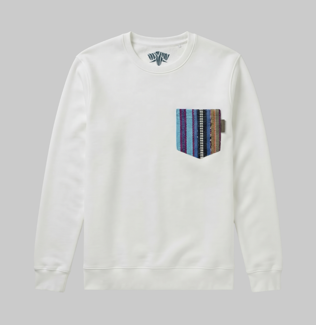 An off-white crewneck sweatshirt with a multi-colored striped knit chest pocket, shown flat on a neutral gray background.