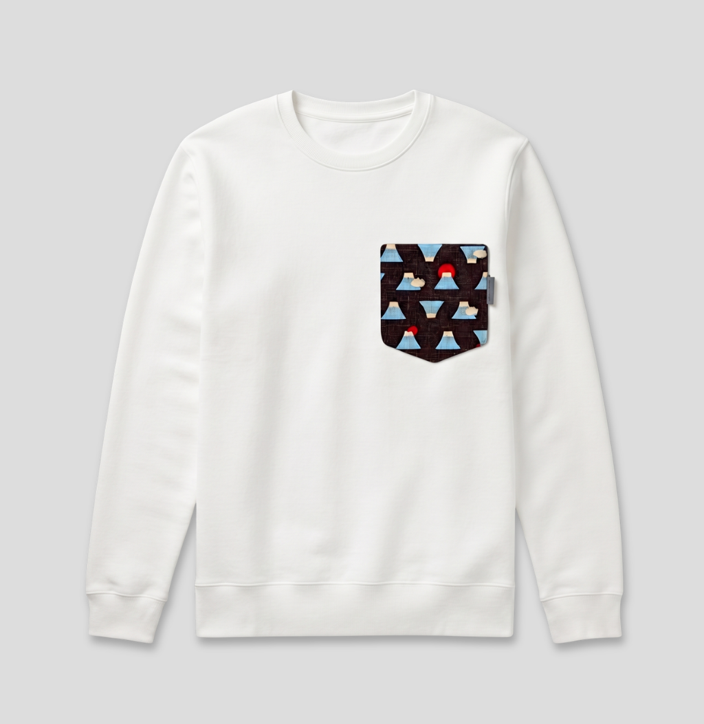 A white crewneck sweatshirt with a front chest pocket featuring a geometric pattern of dark brown triangles, light blue triangles, and a small red accent, shown on a neutral gray background.