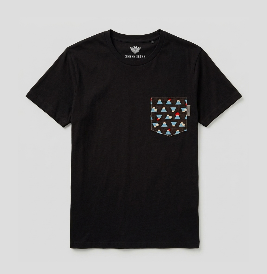 A black short-sleeve crewneck pocket t-shirt by Serengetee, featuring a chest pocket with a geometric triangle pattern in red, blue, and white, displayed on a light gray background.