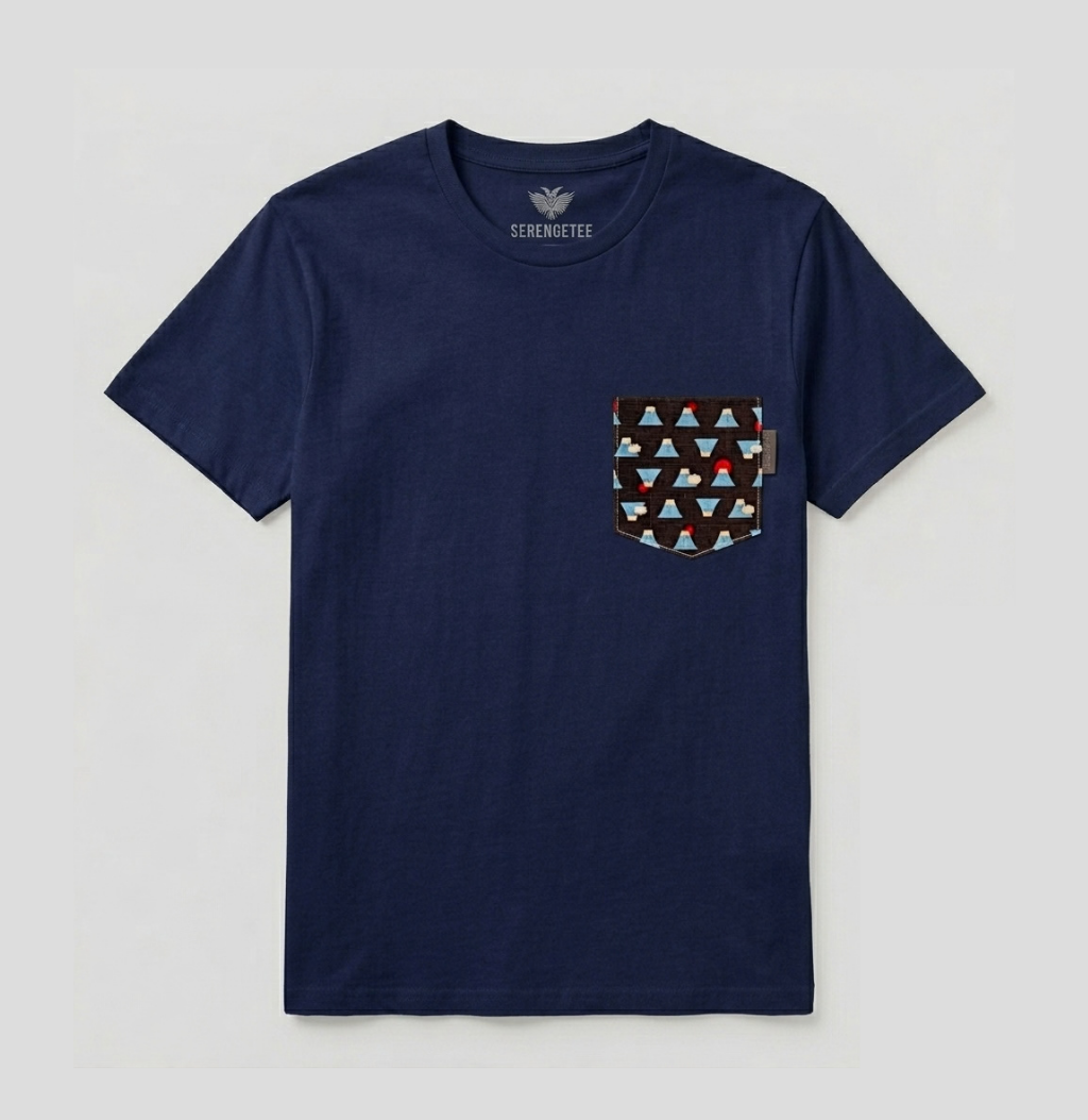 A navy blue short-sleeve pocket t-shirt by Serengetee, featuring a geometric patterned chest pocket with red, brown, and light blue triangles on a white background.