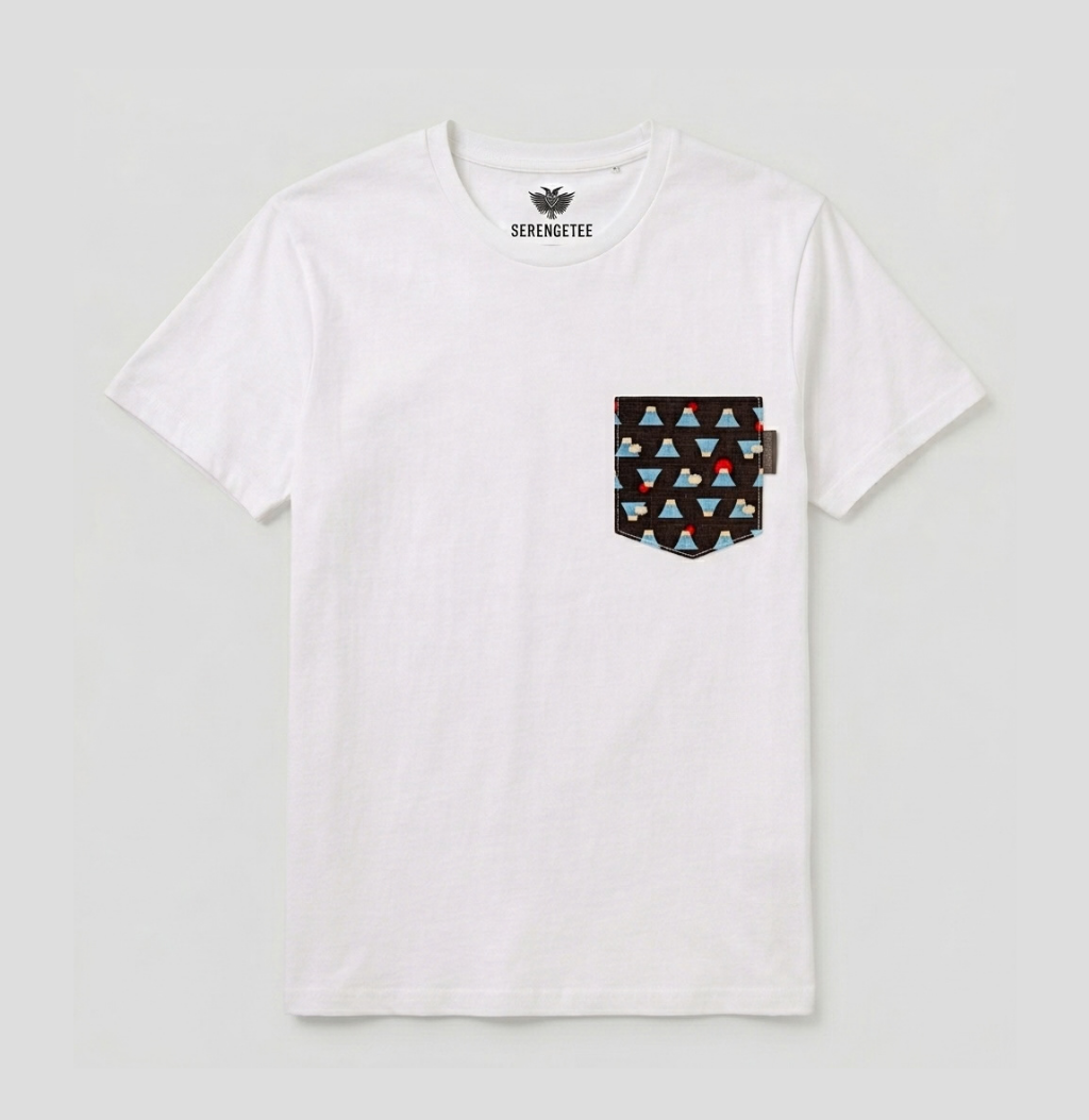 A white short-sleeve crewneck t-shirt by Serenmete, featuring a front chest pocket with a black background and a colorful geometric triangle pattern in blue, red, and beige.