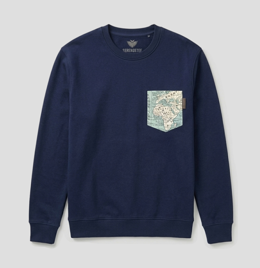 A navy blue crewneck sweatshirt by Veronique, featuring a chest pocket decorated with a vintage-style map print in light blue, beige, and white.