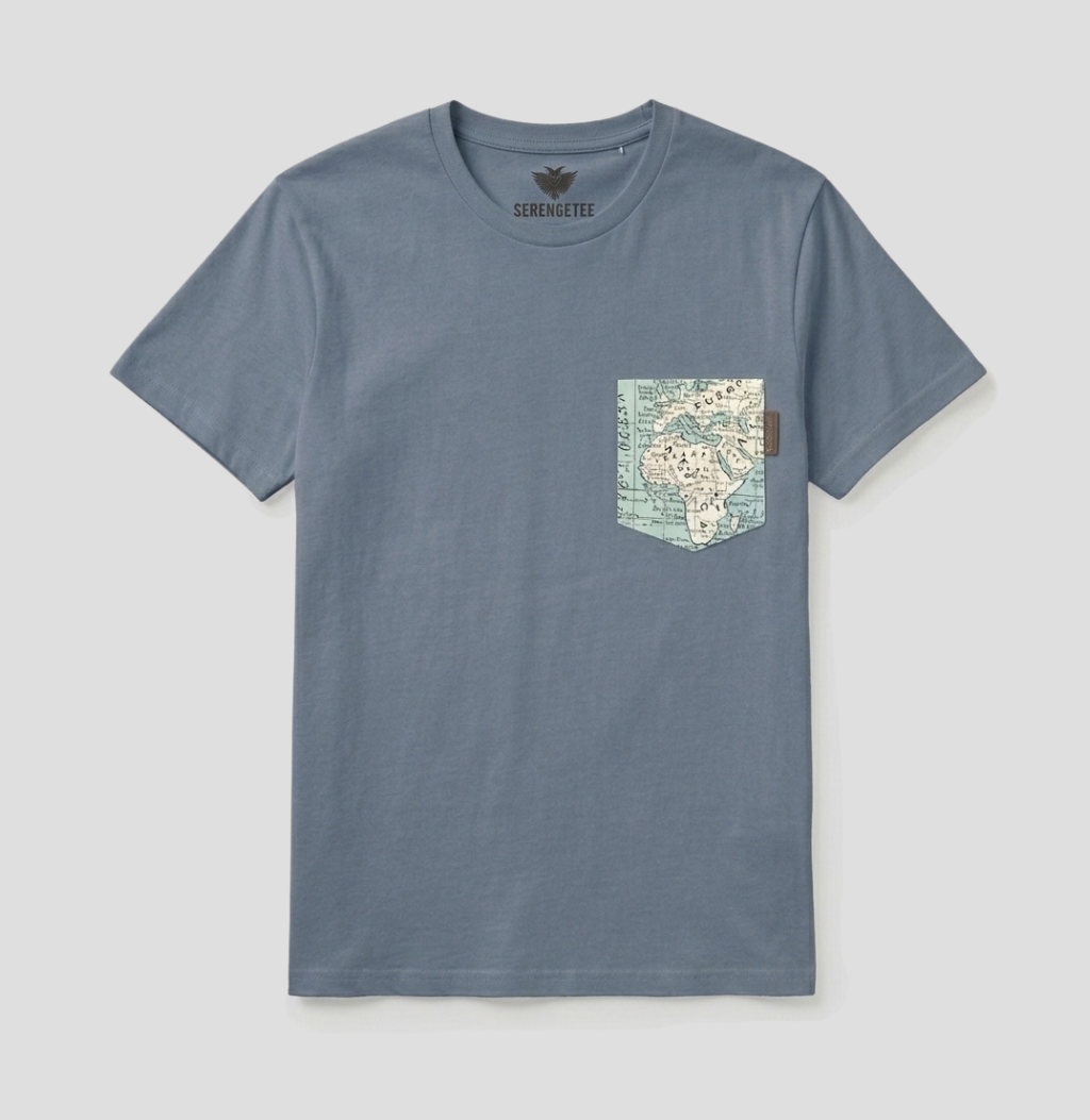 A slate blue crewneck t-shirt with a map graphic printed on the chest pocket, shown flat against a light gray background.