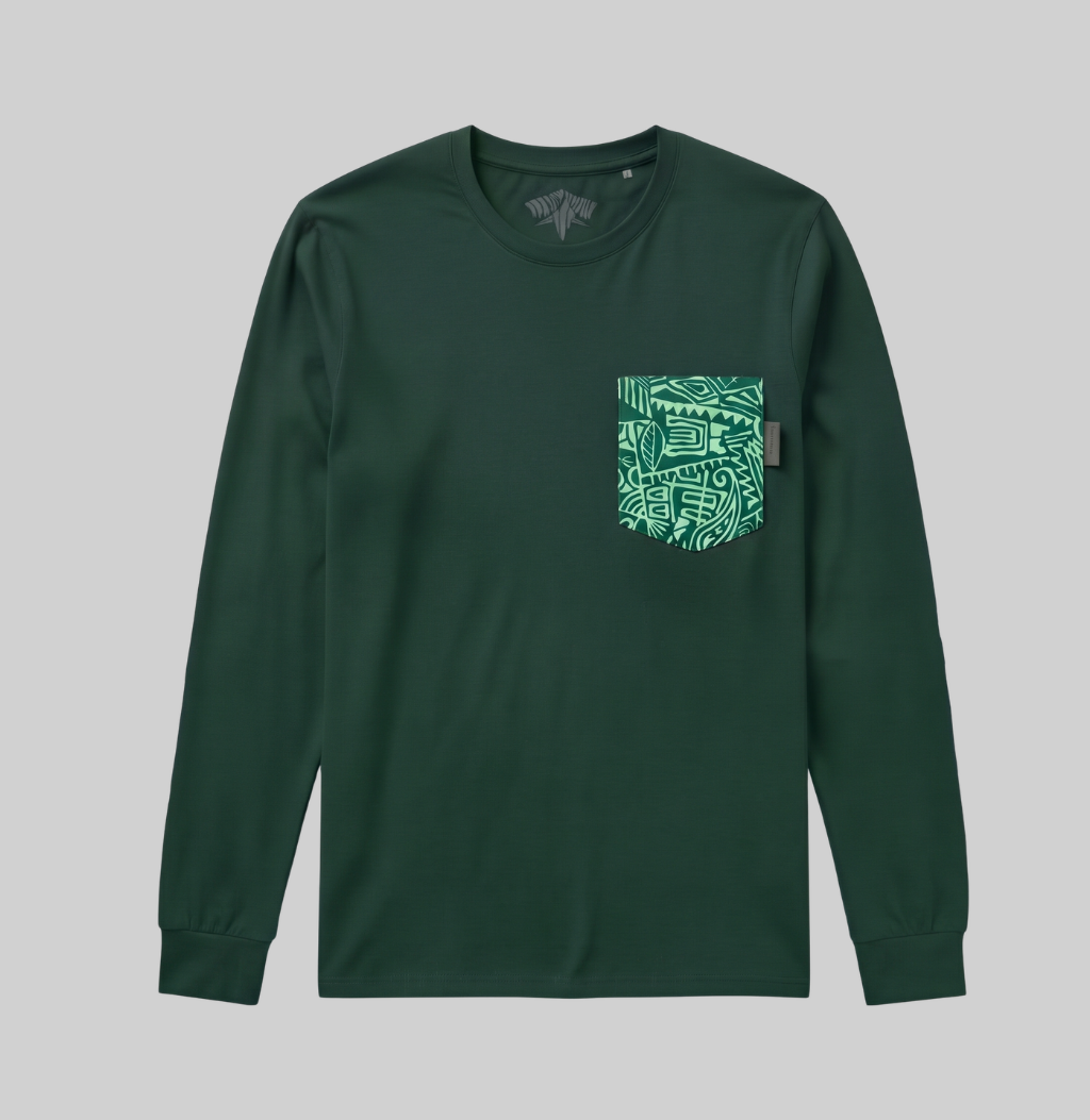 A dark green long-sleeve crewneck t-shirt with a patterned green and white graphic pocket on the left chest, displayed against a solid gray background.