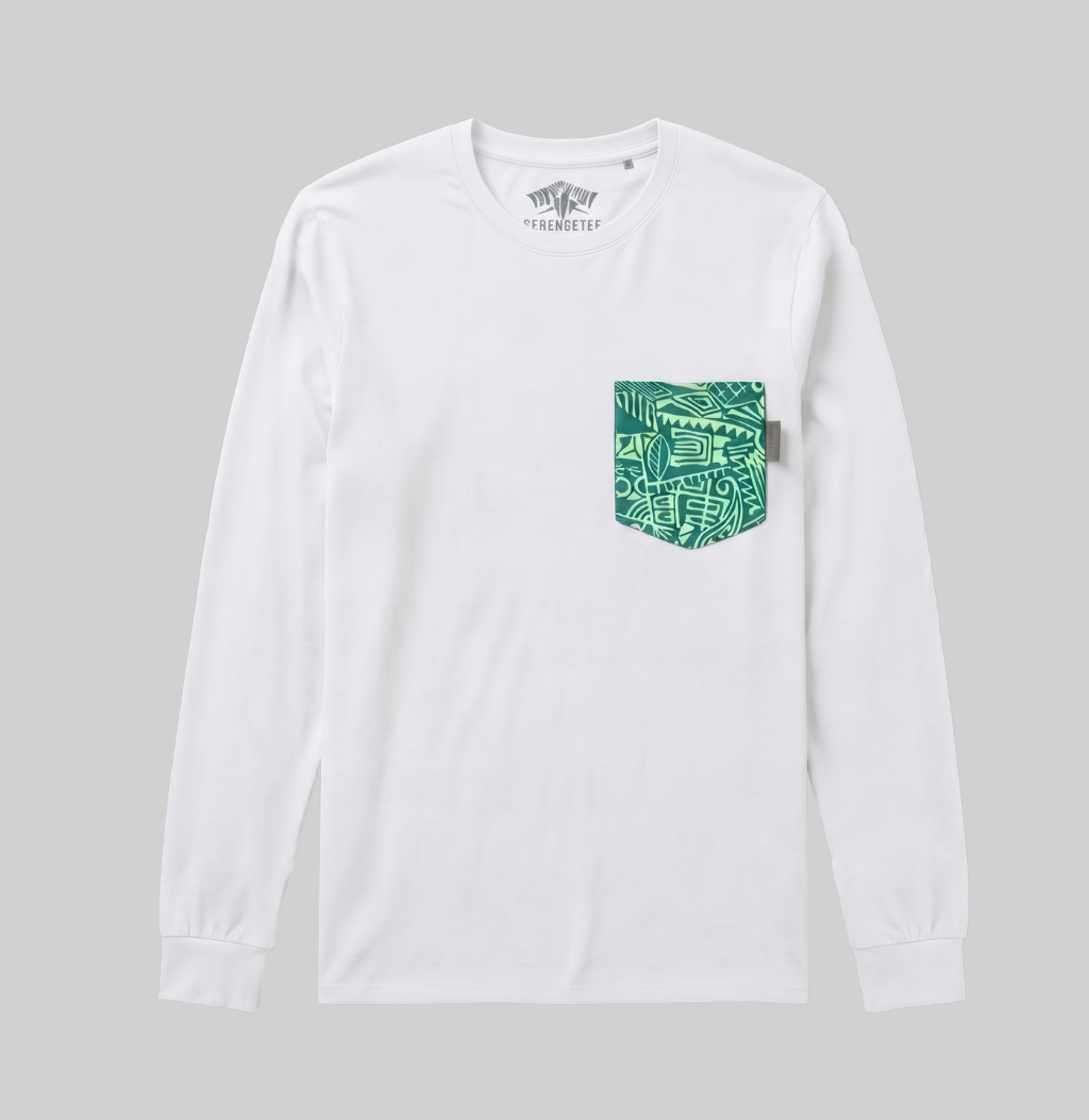 A white long-sleeve crewneck pocket t-shirt with a green and teal graphic pattern on the chest pocket, shown against a solid gray background.