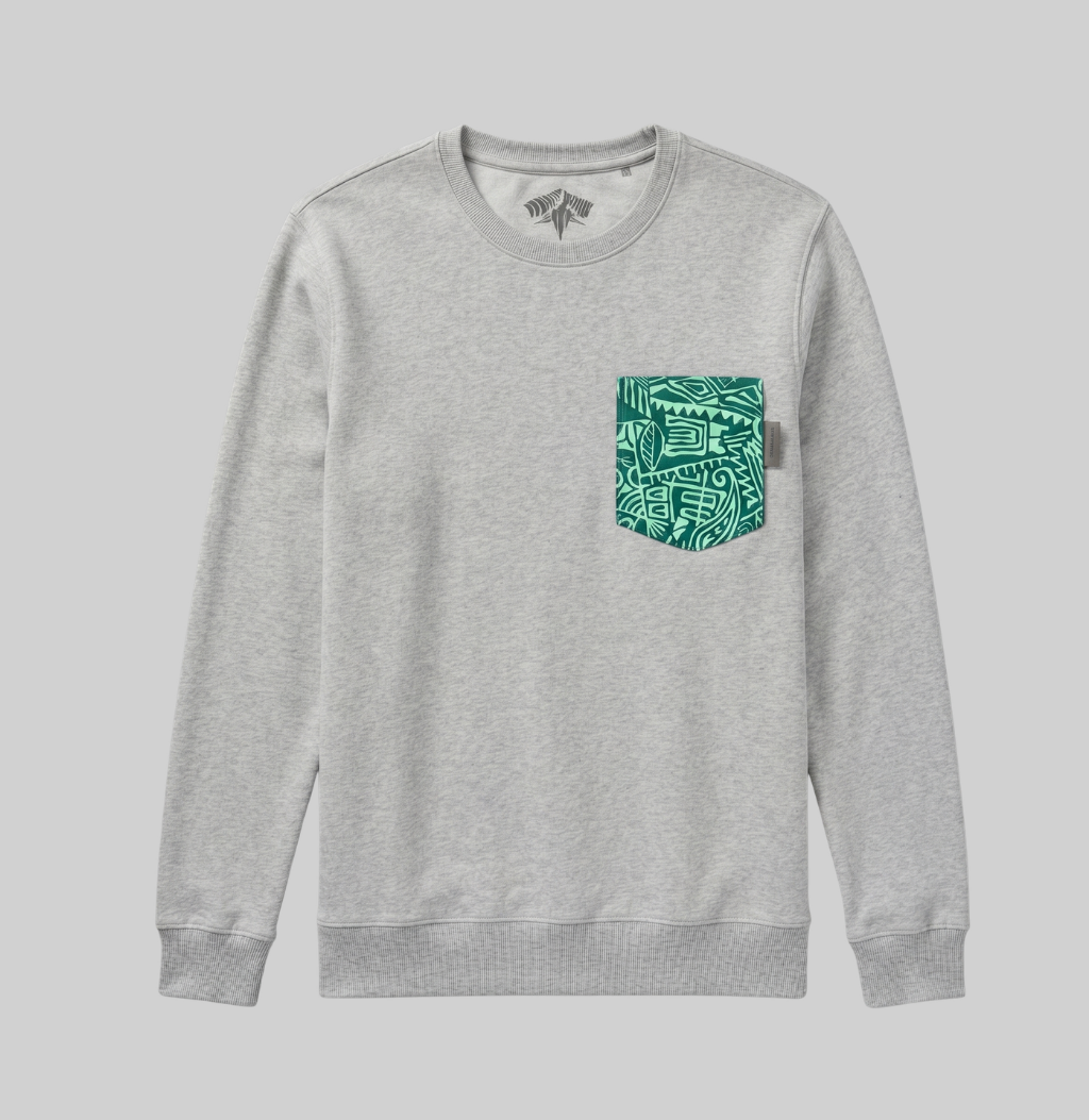 A light heather gray crewneck sweatshirt with a green patterned chest pocket, displayed on a solid gray background.