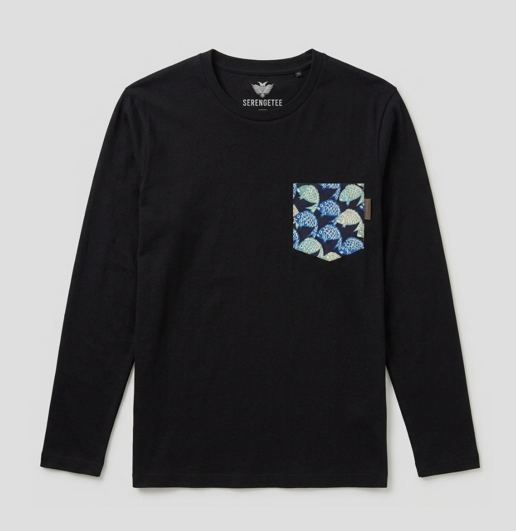A black long-sleeve crewneck shirt by Serenoute, featuring a patterned chest pocket with blue, green, and white leaf-like motifs, displayed on a light gray background.