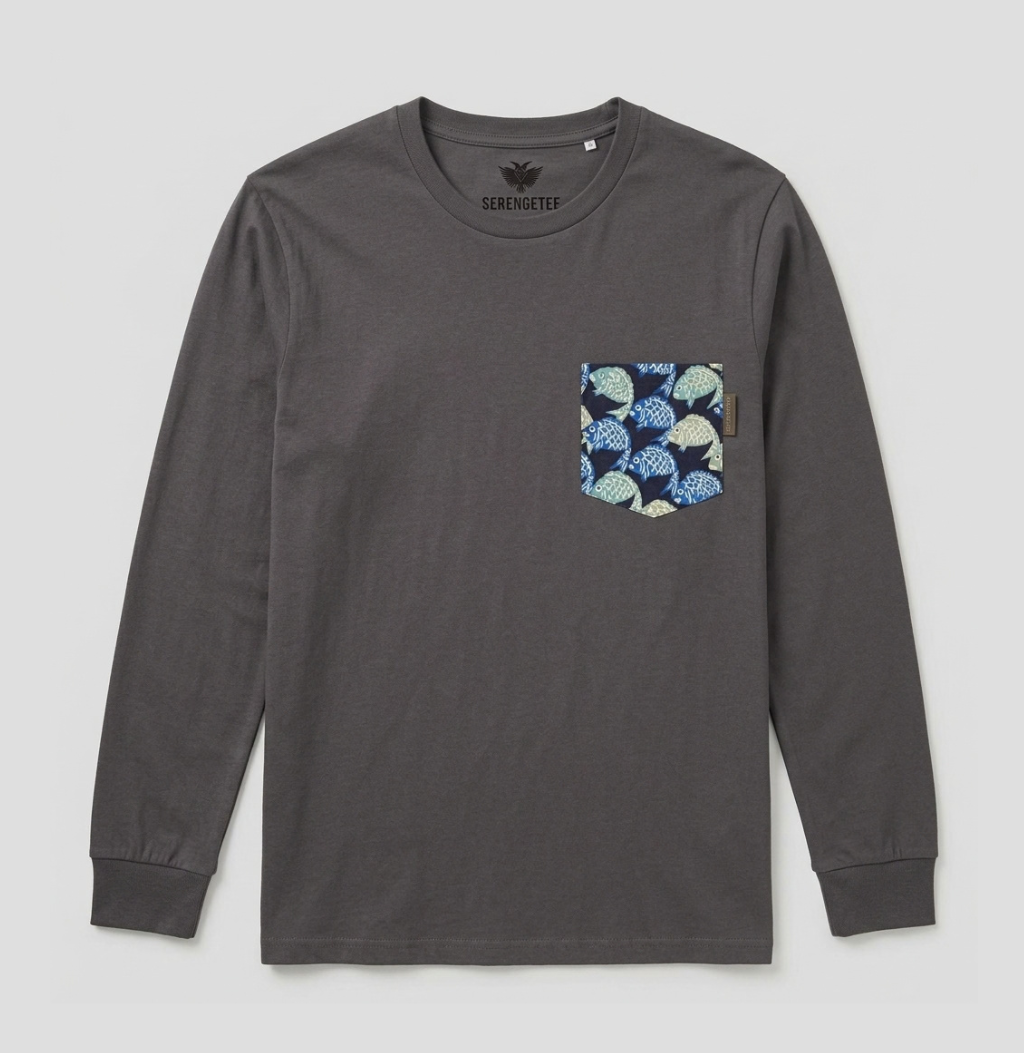 A dark gray long-sleeve t-shirt with a patterned chest pocket featuring blue, green, and white leaf motifs, shown flat on a light gray background.