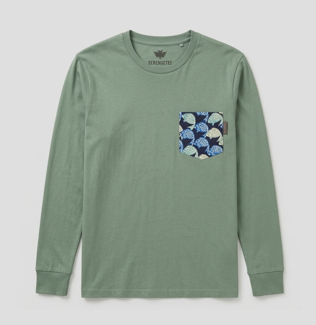 A sage green long-sleeve t-shirt with a patterned chest pocket featuring blue, white, and navy leaf motifs, shown flat on a light gray background.