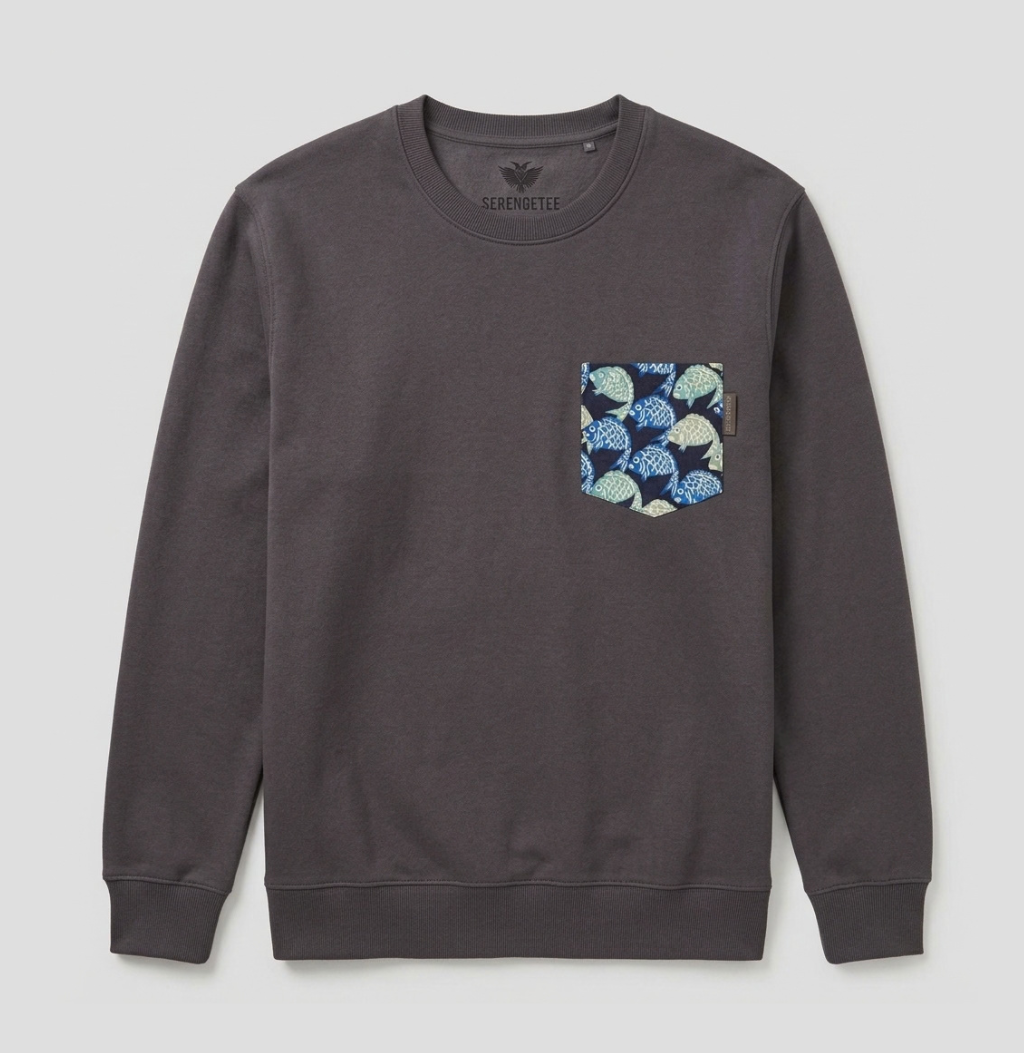 A dark gray crewneck sweatshirt with a patterned chest pocket featuring blue, green, and white leaf motifs, shown flat on a light gray background.