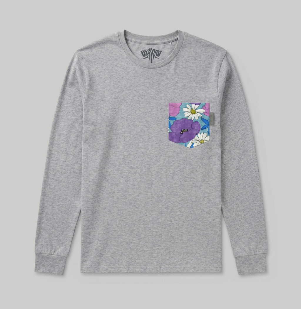 A heather gray long-sleeve crewneck shirt with a colorful floral chest pocket featuring purple flowers and white daisies on a light gray background.