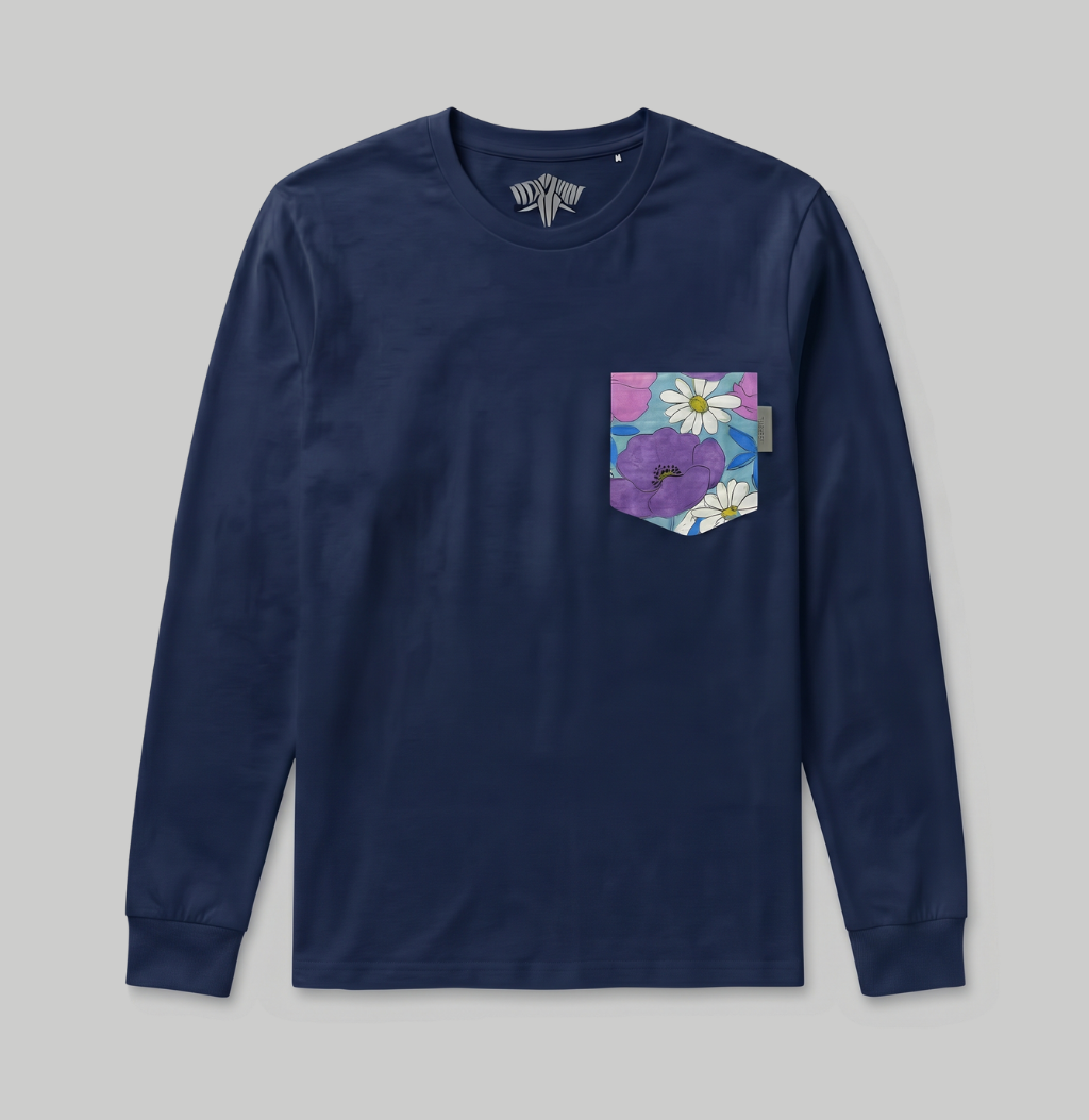 A navy blue long-sleeve pocket shirt with a colorful floral chest pocket featuring purple flowers and white daisies, shown flat on a light gray background.