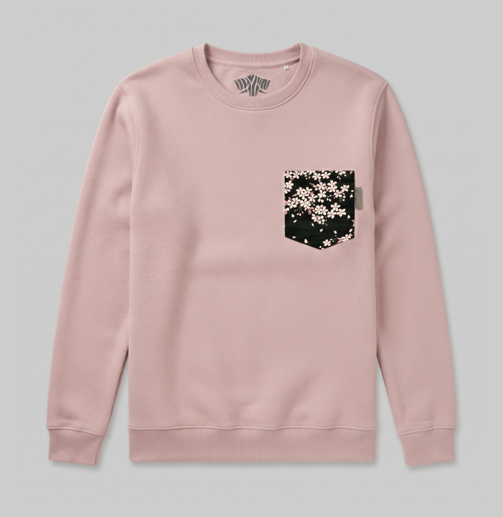 A black floral pattern on a pink crew sweater