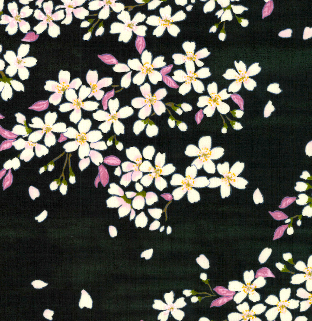 A close-up of a fabric pattern featuring white cherry blossoms with pink petals and yellow centers on a dark green background.