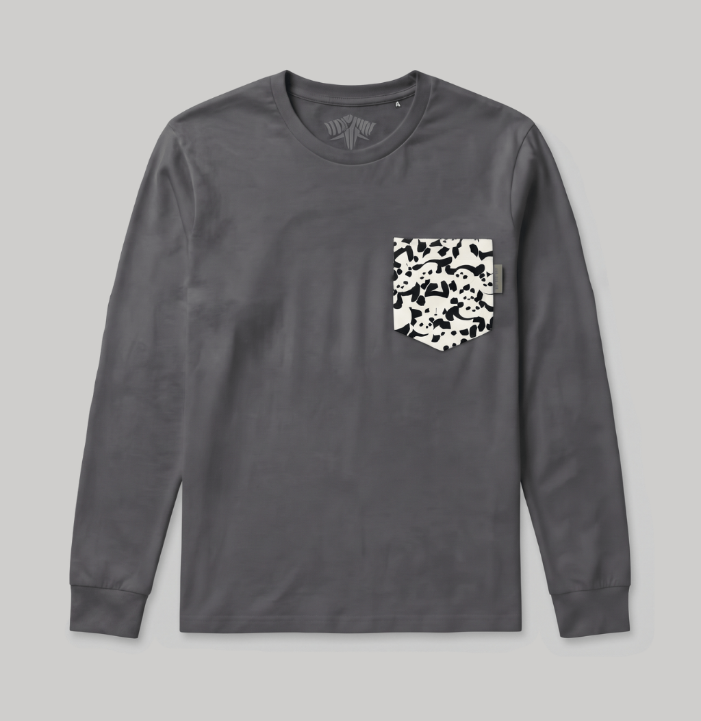 A dark gray long-sleeve t-shirt with a black and white camouflage patterned chest pocket, displayed flat against a light gray background.