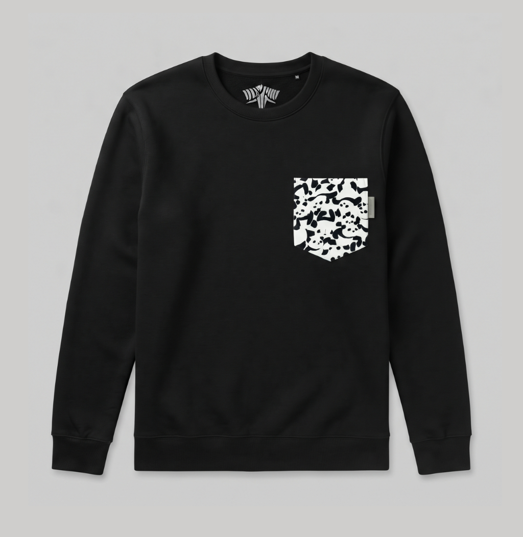 A black crewneck sweatshirt with a white camouflage-patterned chest pocket, displayed flat against a neutral gray background.