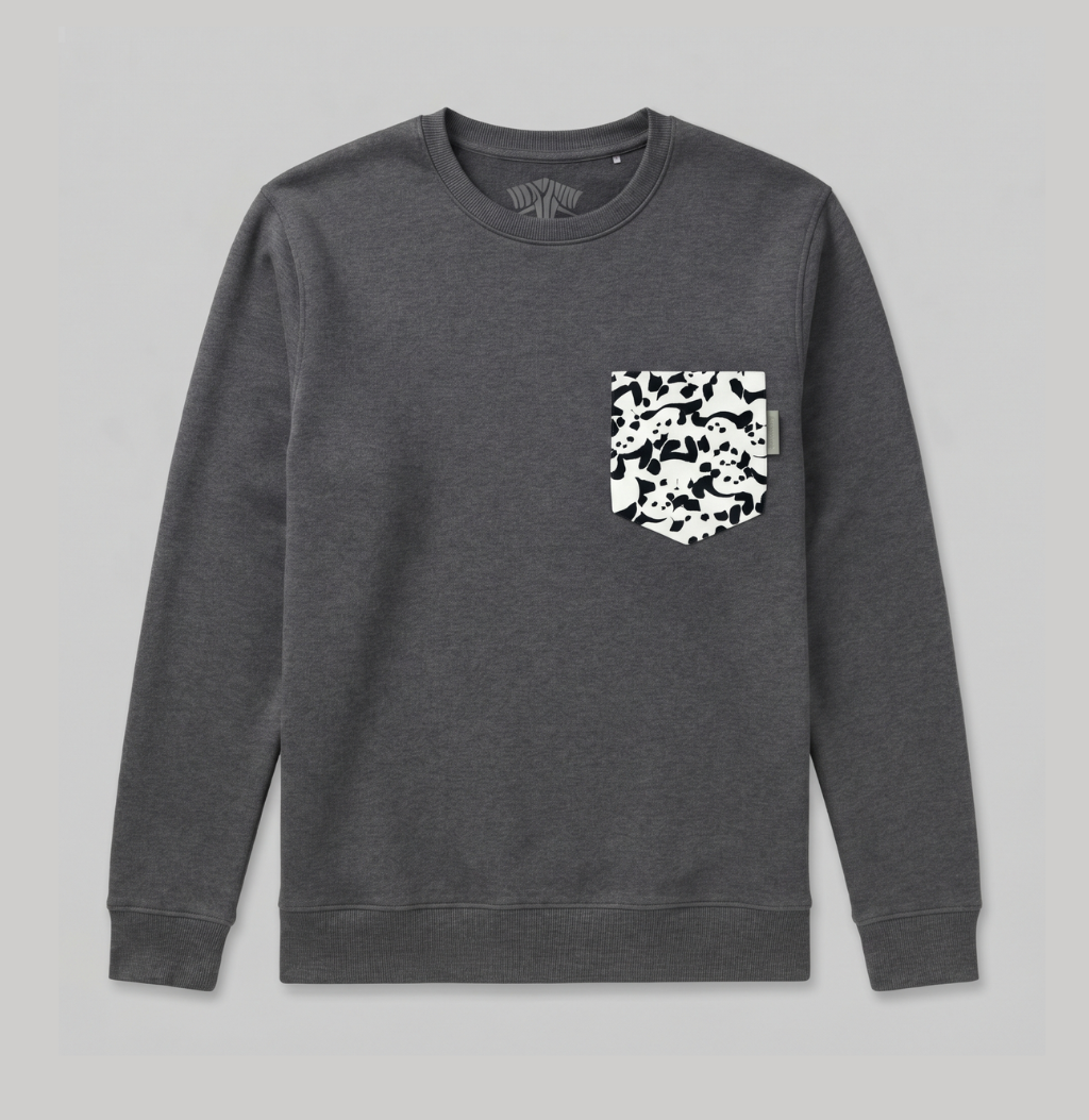 A dark gray crewneck sweatshirt with a black and white camouflage patterned chest pocket, displayed flat against a light gray background.