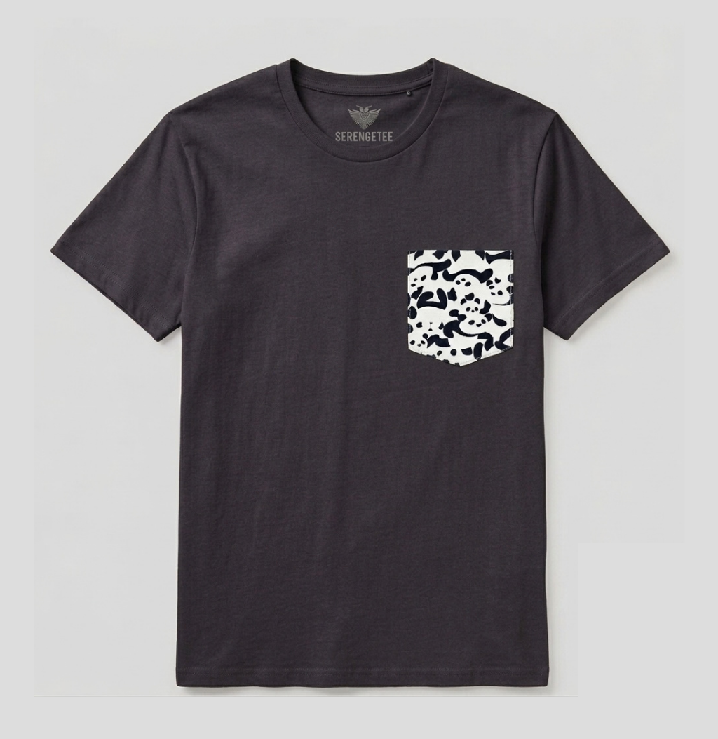 A dark charcoal gray crewneck t-shirt with a black and white skull-and-crossbones patterned chest pocket, shown flat on a light gray background. The brand name 'SCORPIONETTE' is printed inside the collar.