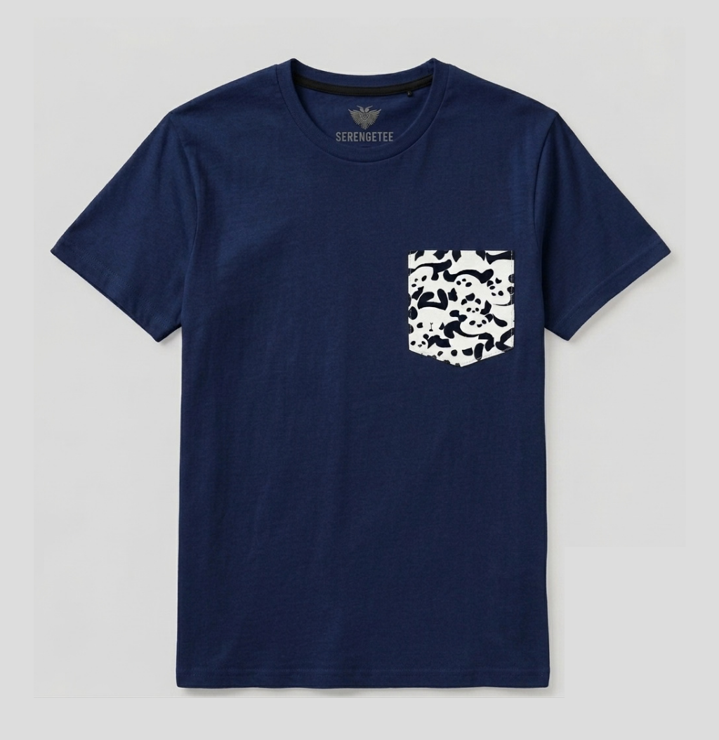 A navy blue crewneck t-shirt with a white and black skull-patterned chest pocket, shown flat against a light gray background. The brand name 'SERENGETEE' is printed inside the collar.