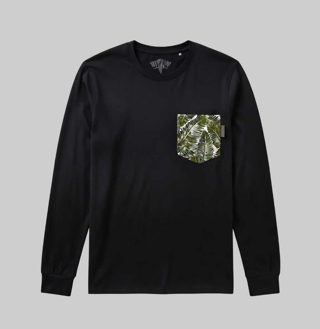 A black long-sleeve crewneck shirt with a green and white tropical leaf pattern pocket on the left chest, displayed on a solid gray background.