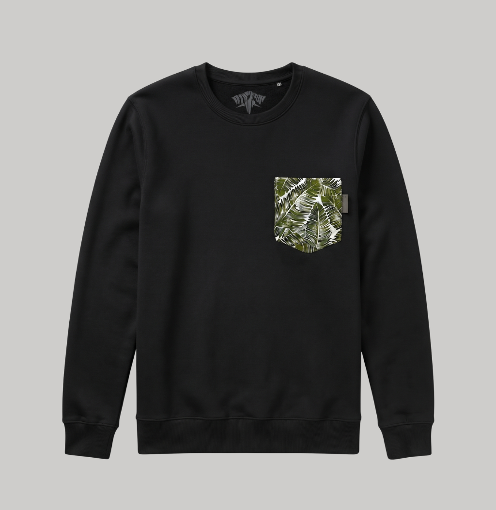 A black crewneck sweatshirt with a chest pocket featuring a green and white tropical leaf pattern, displayed on a solid gray background.