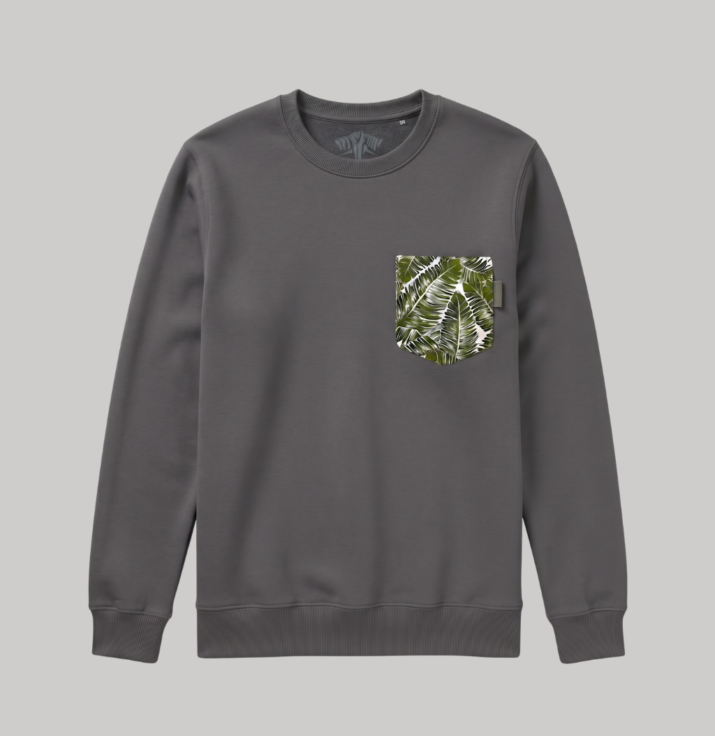 A dark gray crewneck sweatshirt with a green and white tropical leaf pattern pocket on the left chest, displayed against a solid gray background.
