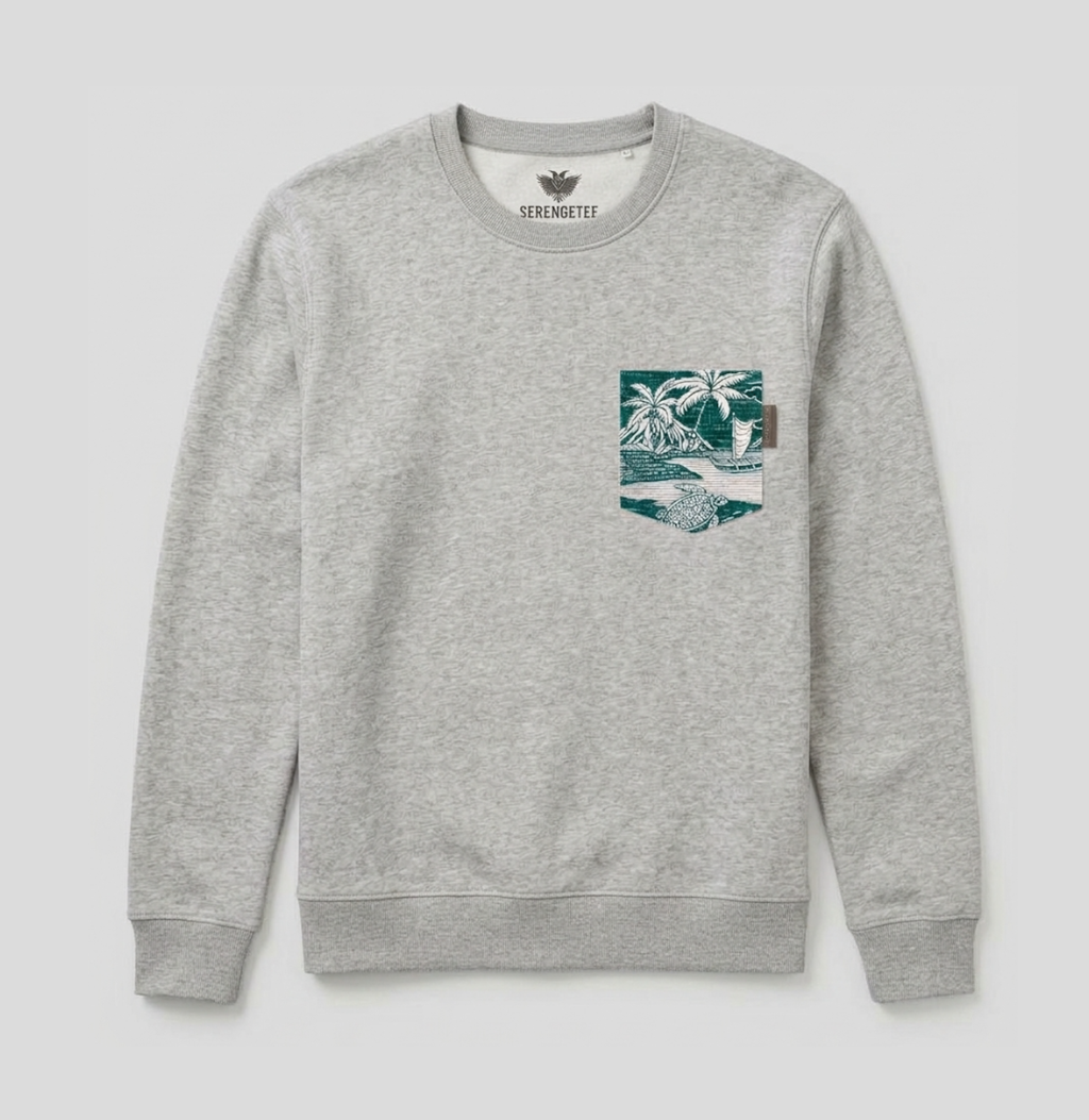 A light gray heather crewneck sweatshirt by Seraphholt, featuring a graphic print on the left chest depicting a beach scene with palm trees and a wave in teal and white.