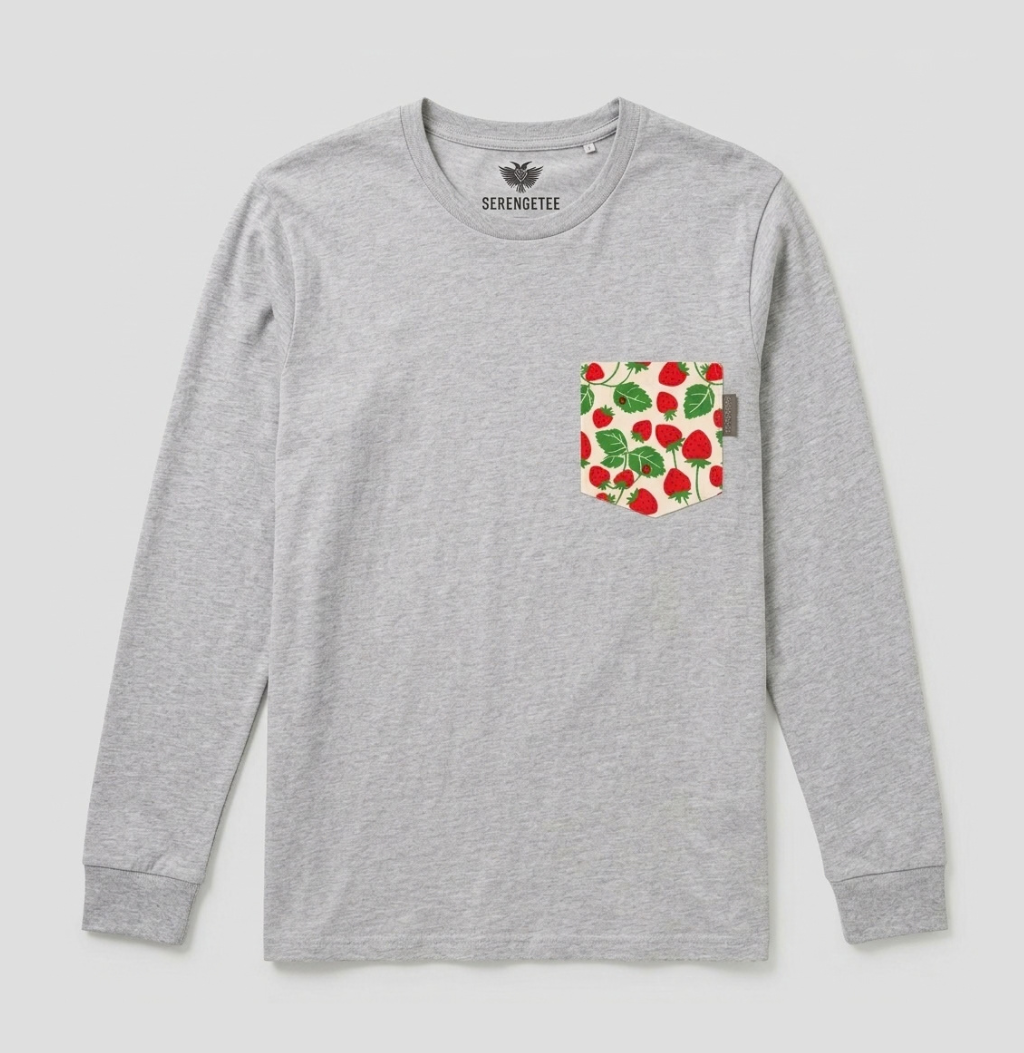 A light gray long-sleeve crewneck shirt by Serenméte, featuring a chest pocket with a strawberry and leaf pattern on a cream background.