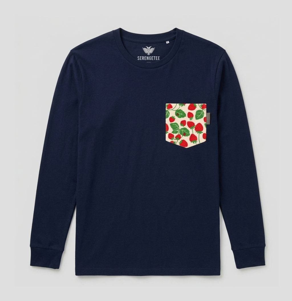 A navy blue long-sleeve crewneck shirt by Serenmüte, featuring a chest pocket with a red strawberry and green leaf pattern on a cream background.