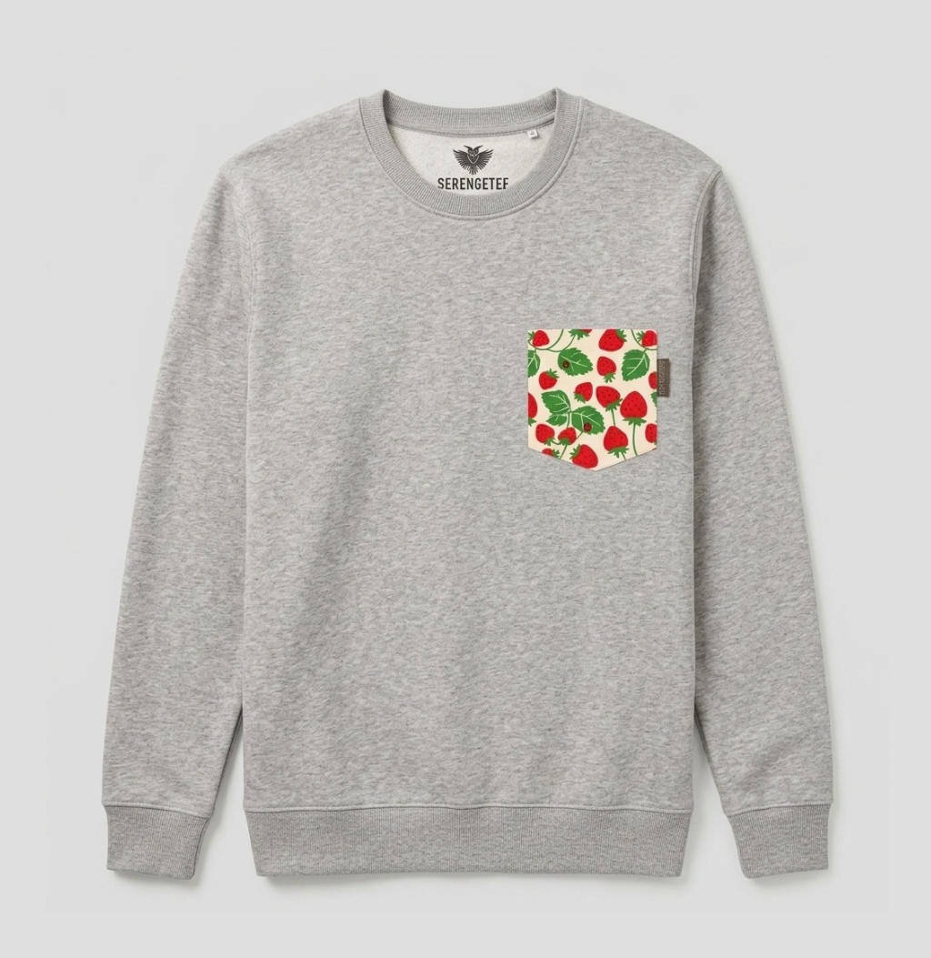A heather gray crewneck sweatshirt by SekoMeter featuring a front chest pocket with a red strawberry and green leaf pattern, shown against a light gray background.