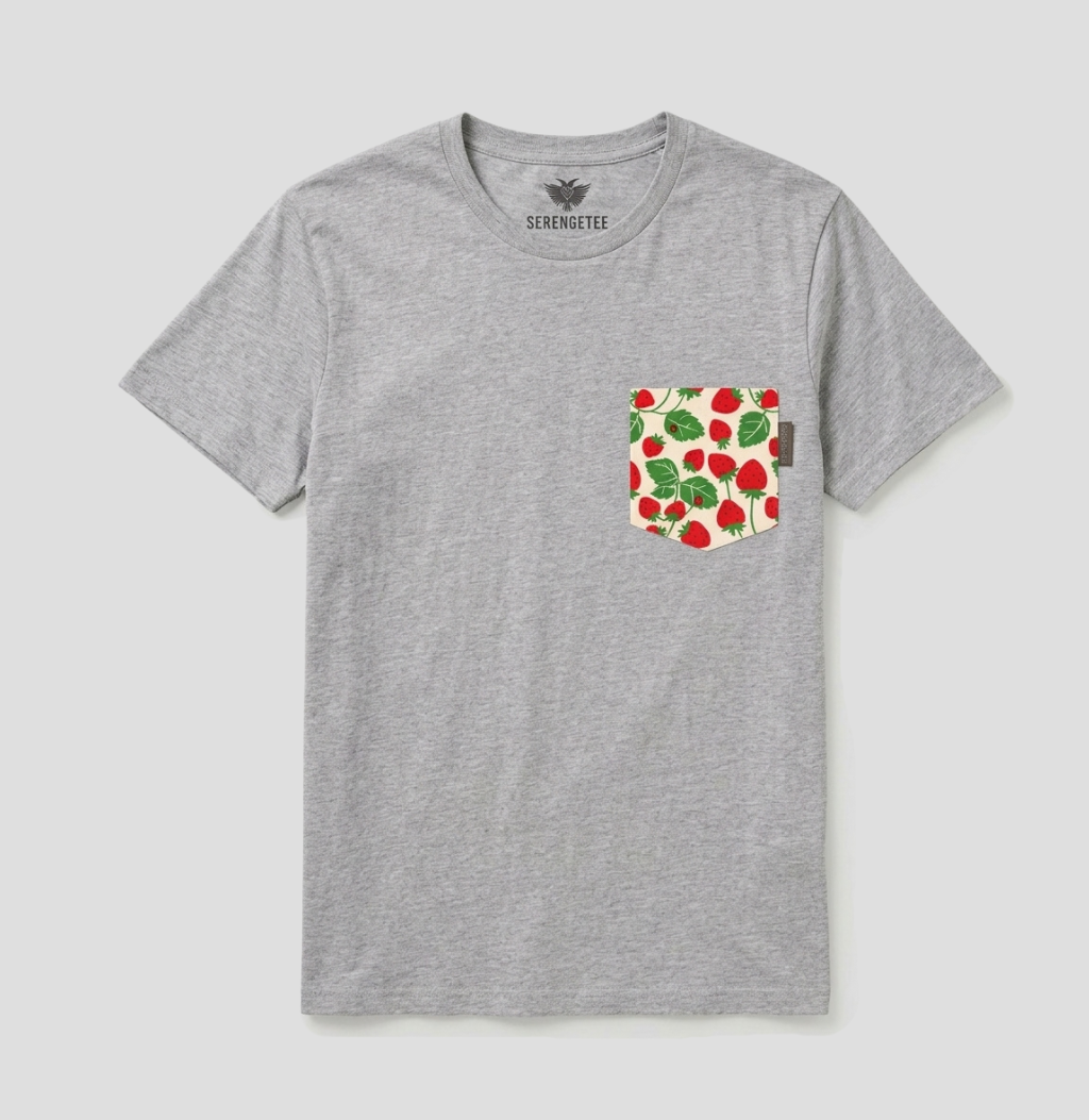 A heather gray crewneck t-shirt by Seremester, featuring a front chest pocket with a red strawberry and green leaf pattern, shown on a light gray background.