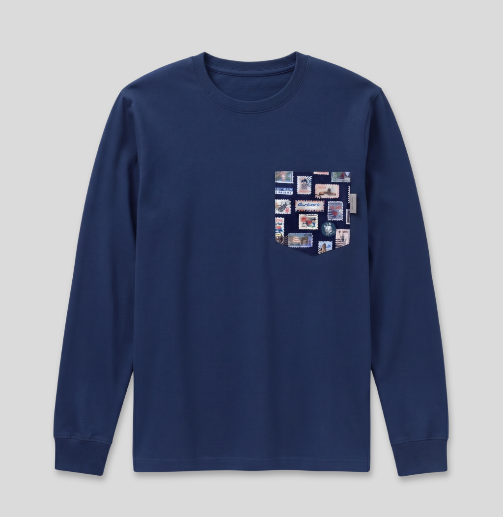 Navy passport stamp fabric pocket on a navy long sleeve shirt.